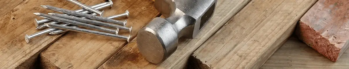 Hammer and nails on hardwood flooring boards in Anaheim, CA