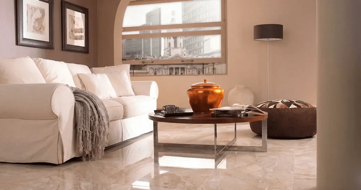 Modern living room with professionally installed marble flooring, a beige sofa, coffee table in Anaheim, CA