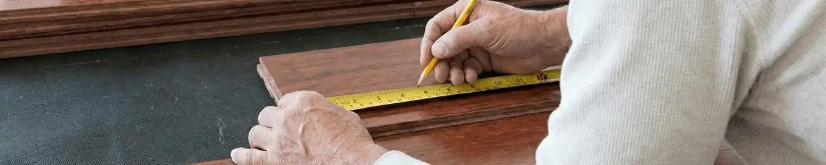 A professional installing wood flooring in Anaheim, CA
